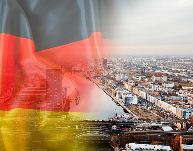 Aerial drone view of Berlin, Germany. District with river, yellowed trees, buildings and Berlin Television Tower in the distance